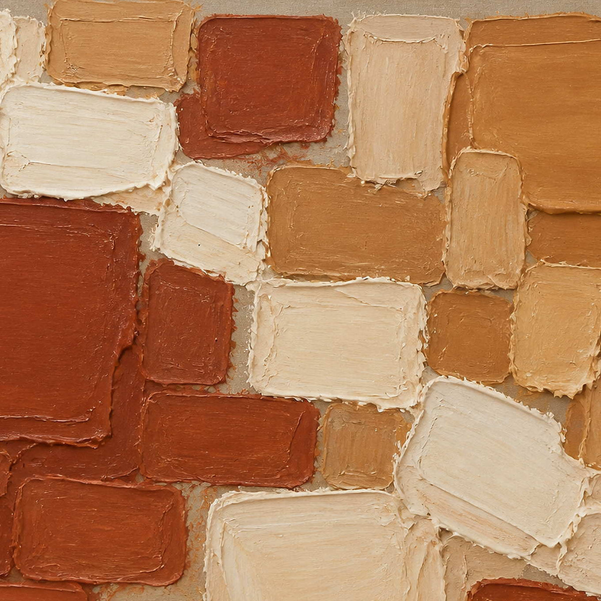 Close-up of the painted texture in terracotta, ochre, and cream painted blocks.