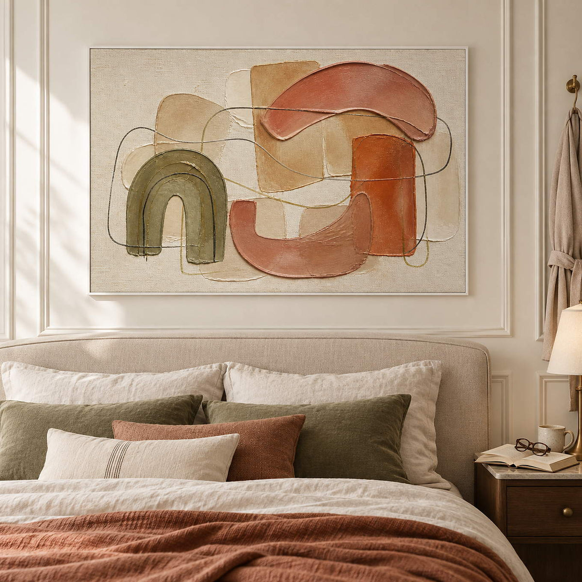 Boho abstract painting with olive, terracotta, blush, and sand arches in a white frame in a bedroom.