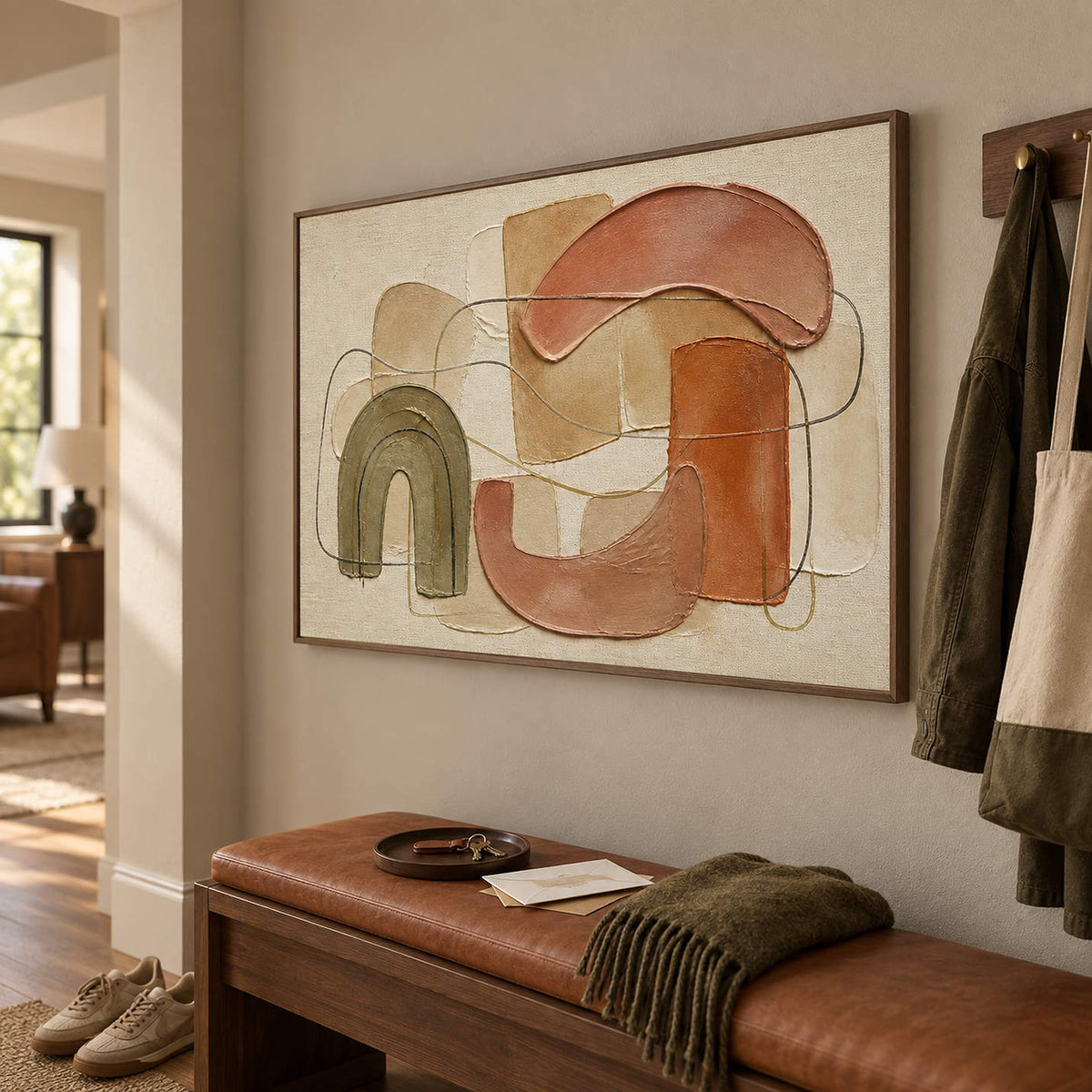 Boho abstract painting with olive, terracotta, blush, and sand arches in a brown wood frame in a dressing area.