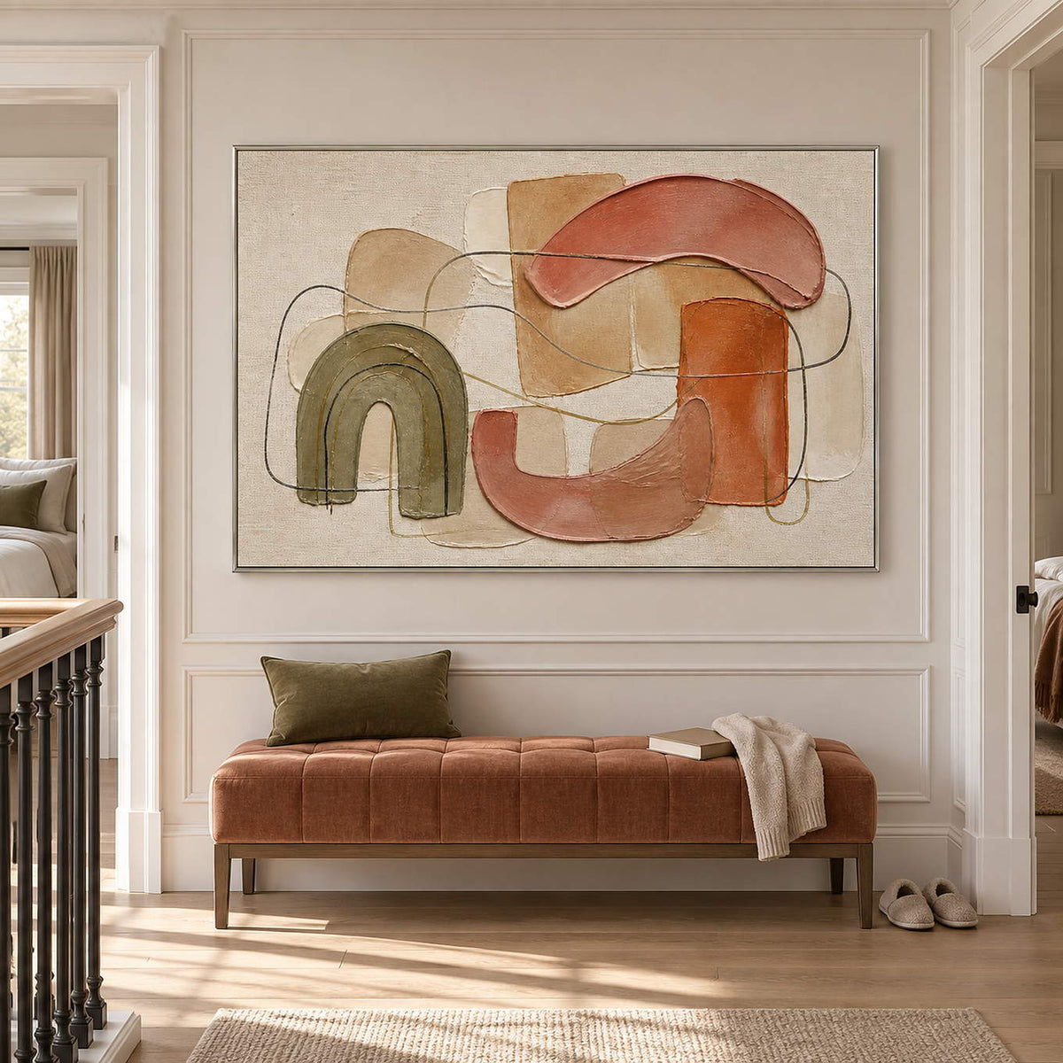Boho abstract painting with olive, terracotta, blush, and sand arches in a silver frame in a hallway.