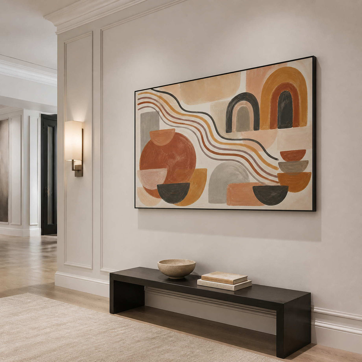 Horizontal boho wall art displayed above a minimalist entryway bench.