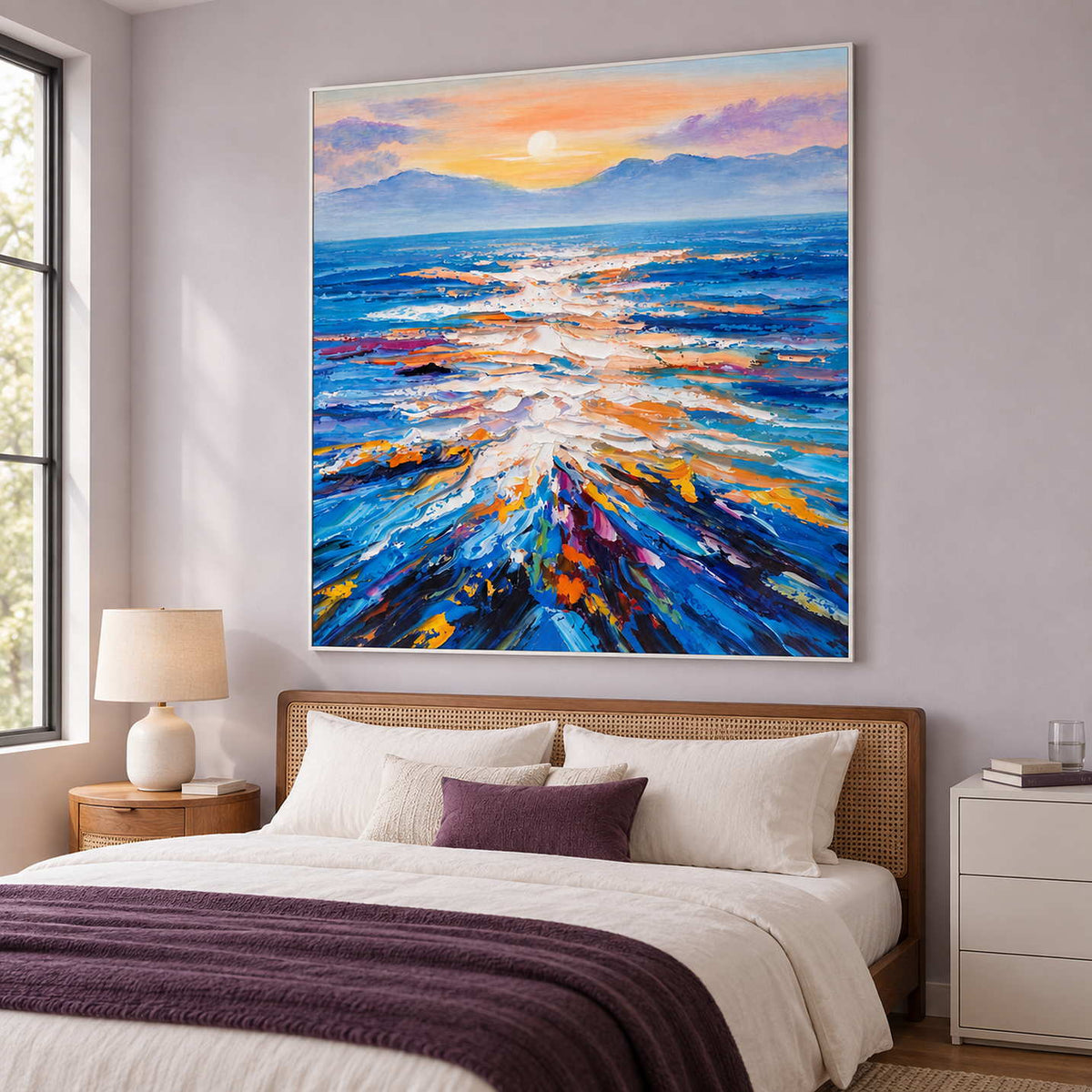 Textured sea reflection artwork above a woven headboard and a bed with a plum throw.