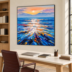 Colorful seascape above a light desk with a laptop and a brown office chair.