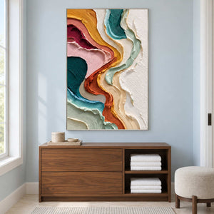 Tall abstract on a pale blue wall above a towel cabinet.