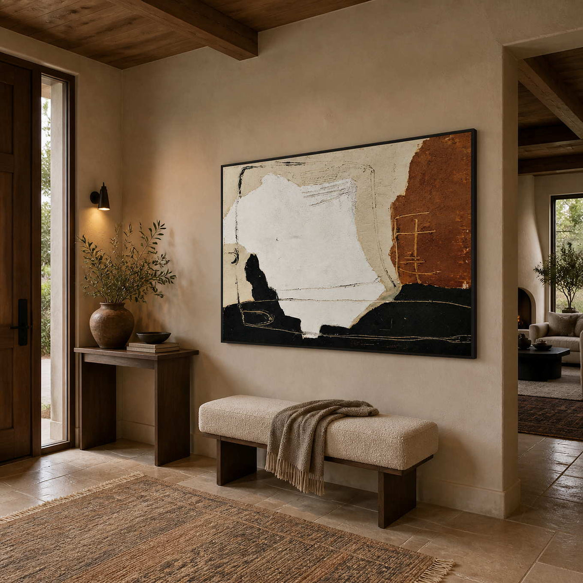 Warmth Goes with You in a wood frame above an upholstered entryway bench, viewed from the side.