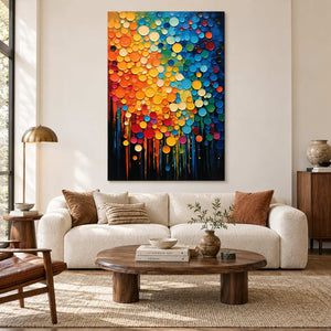 Colorful circle abstract above a cream sofa and a low oval wooden coffee table.