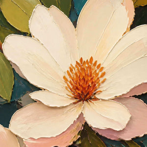 Close-up of raised ivory petals and warm orange floral texture.