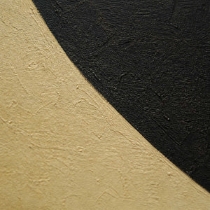 Close-up of warm ivory and near-black hand-painted geometric texture.