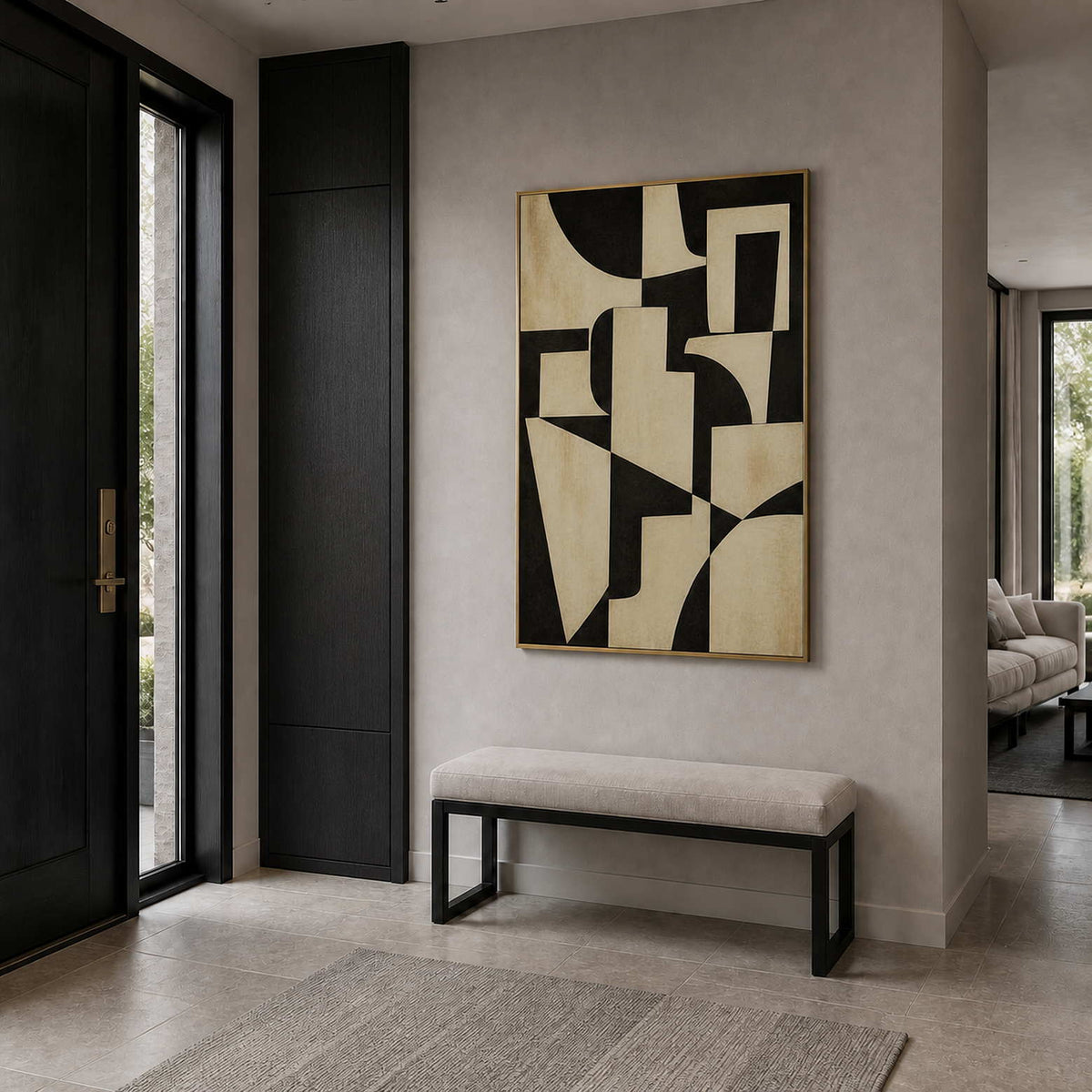 Black and ivory geometric artwork viewed in a cool gray entryway.