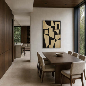 Modern geometric artwork displayed in a deep walnut dining room.