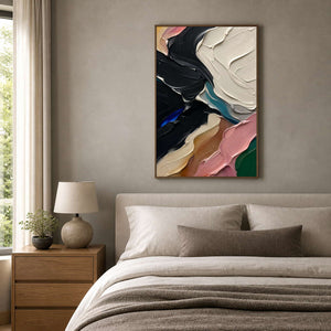 Textured black and pink canvas creates depth above a neutral bed.