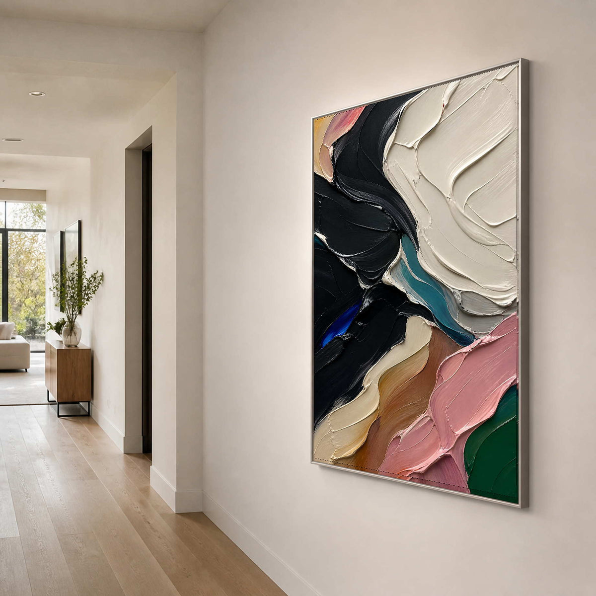 Black and ivory impasto painting anchors a light contemporary hallway.