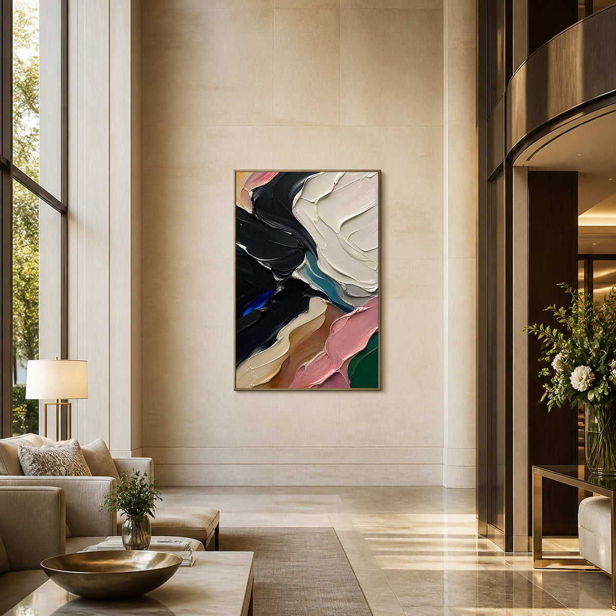 Vertical black and ivory abstract wall art in a bright hotel lobby.