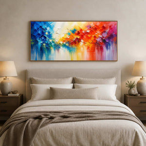 Colorful panoramic abstract wall art displayed above a serene neutral bed.