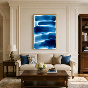 Cobalt blue and white minimalist abstract wall art in a classic neutral living room.