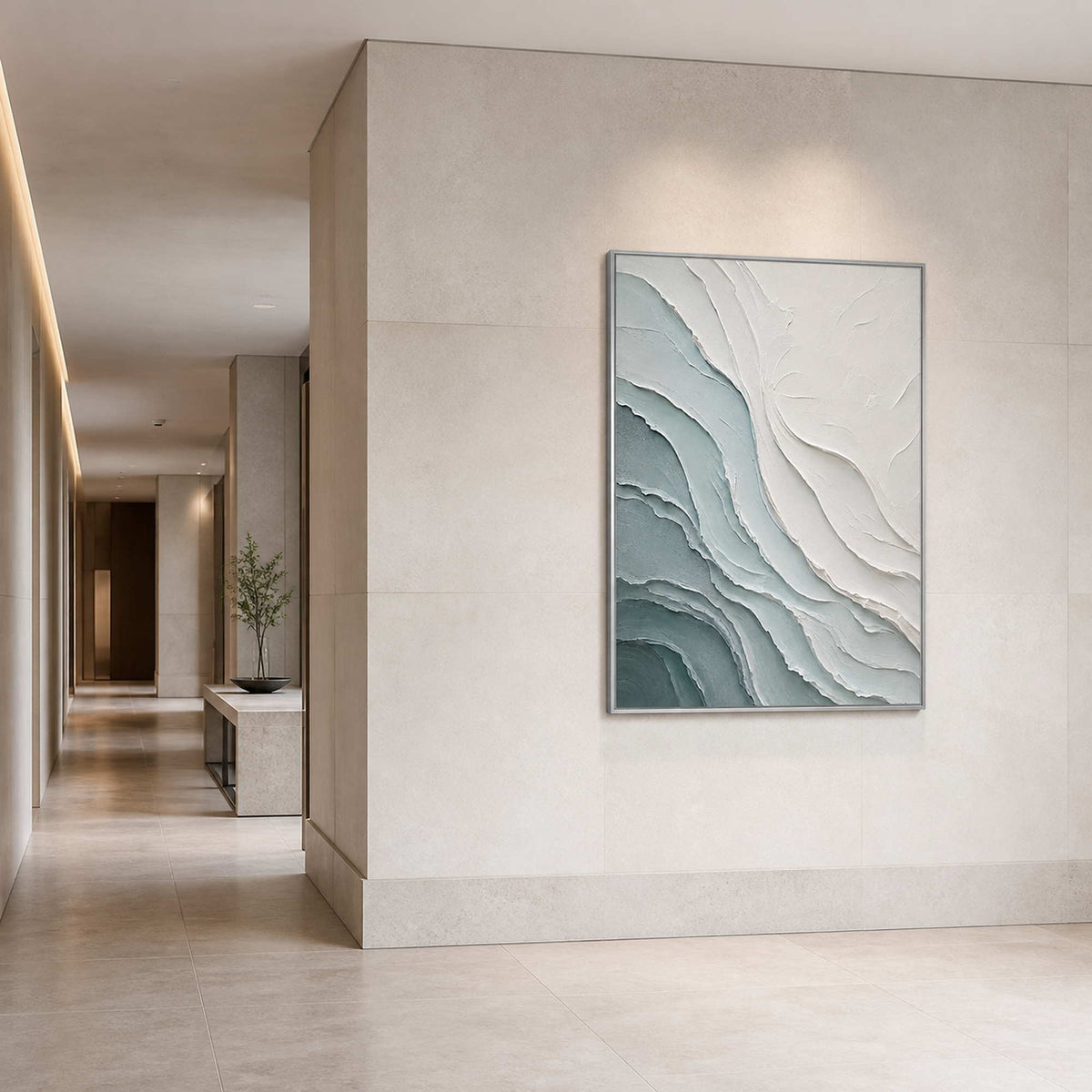 Textured coastal wall art displayed in a limestone boutique hotel corridor.
