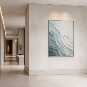 Textured coastal wall art displayed in a limestone boutique hotel corridor.