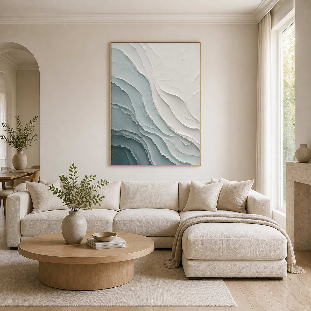 Textured coastal wall art displayed in a warm modern living room.