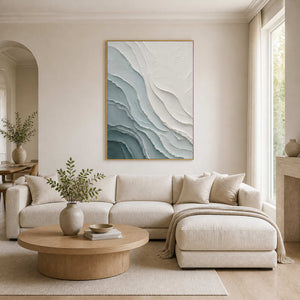 Textured coastal wall art displayed in a warm modern living room.