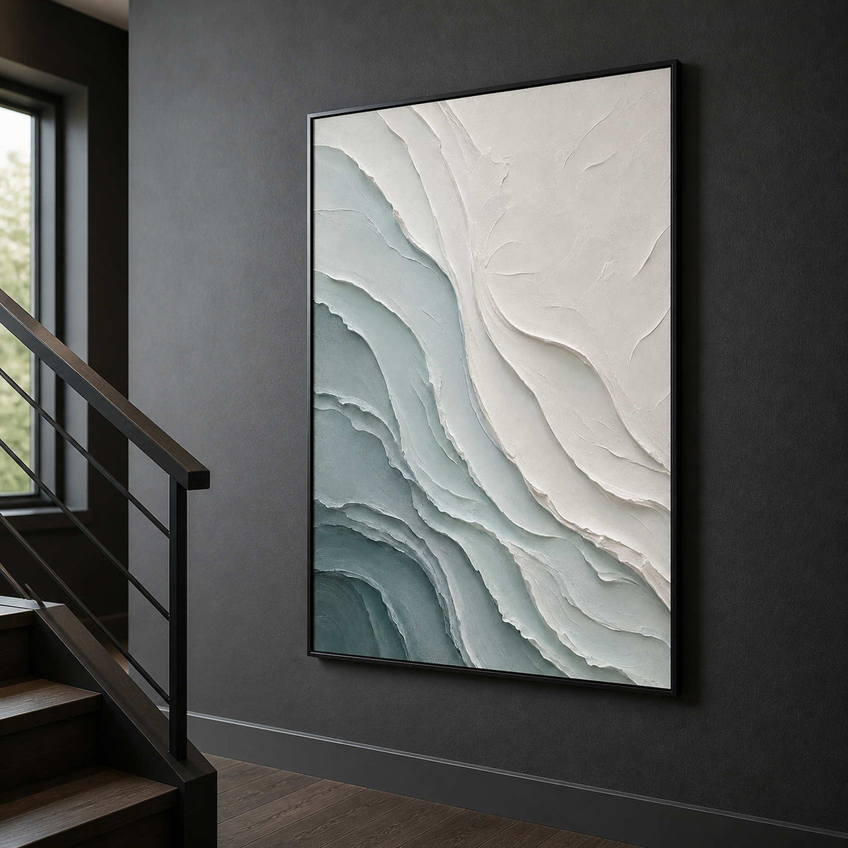 Textured coastal wall art displayed on a charcoal stair landing.