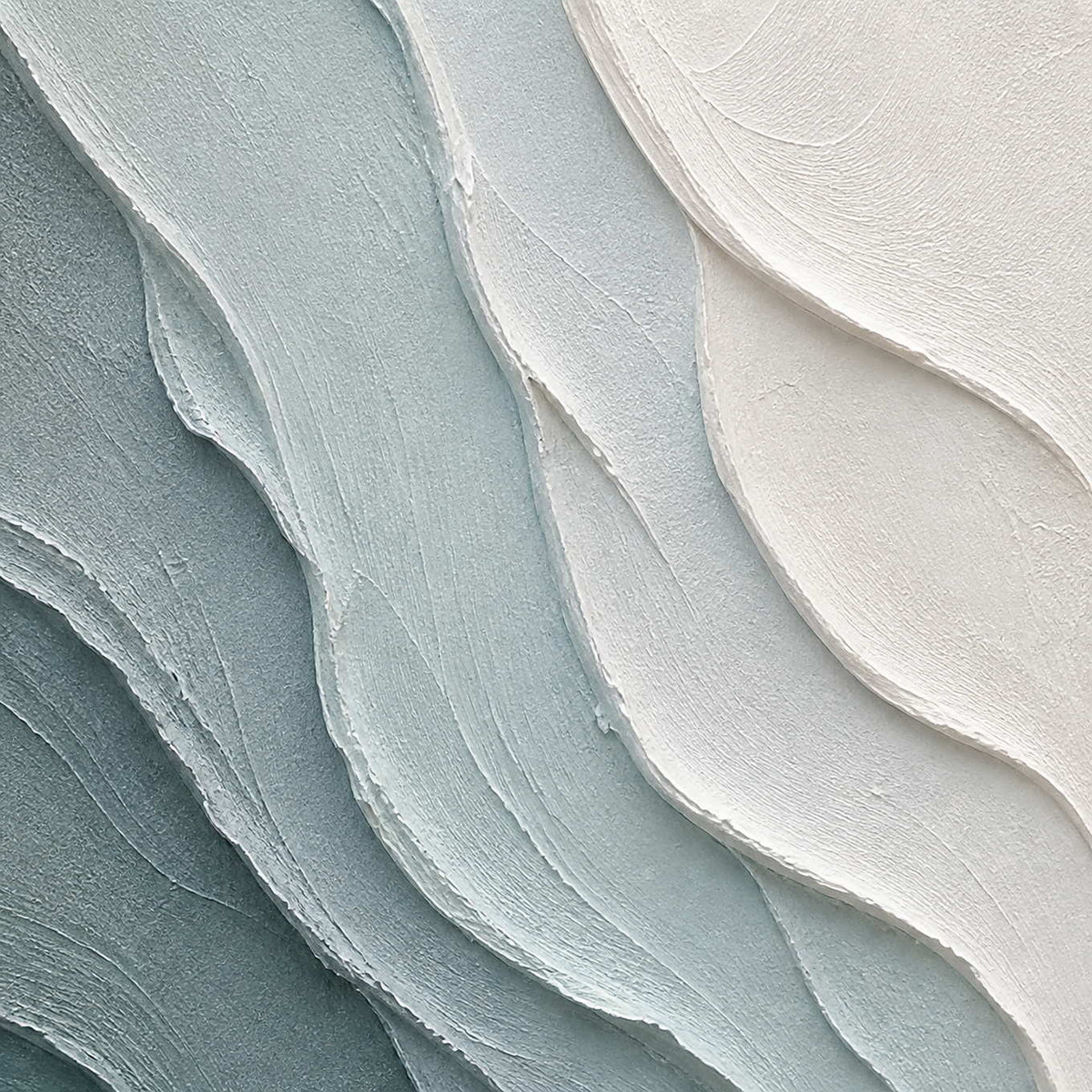 Close-up of layered blue-gray and chalk-white palette-knife texture.