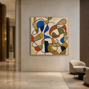Square abstract wall art displayed in a warm contemporary hotel lobby.