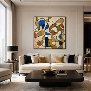 Textured abstract wall art in cobalt, ochre, and olive displayed in a modern living room.