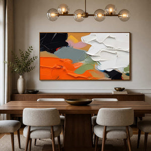 Orange and white abstract art adds sculptural color to an elegant dining room.