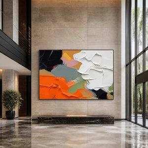 Bold textured abstract painting displayed in a contemporary hotel lobby.