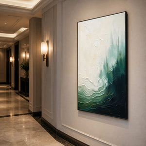 Deep green coastal wall art displayed along a warmly lit hallway.