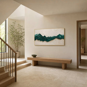 Panoramic mountain wall art displayed on a bright residential stair landing.