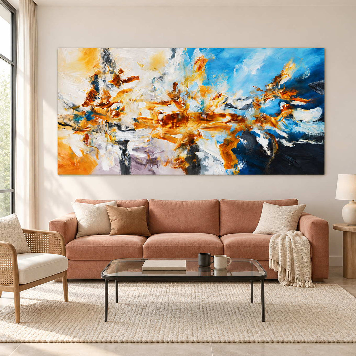 Blue-and-orange abstract above a warm pink sofa.