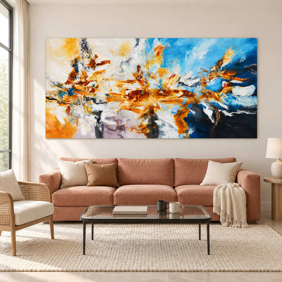 Blue-and-orange abstract above a warm pink sofa.