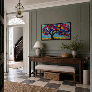 Textured tree wall art displayed in an elegant green entryway.