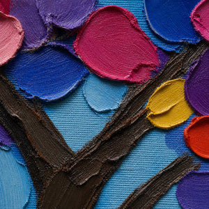 Close-up of thick blue, pink, violet, and gold palette-knife texture.