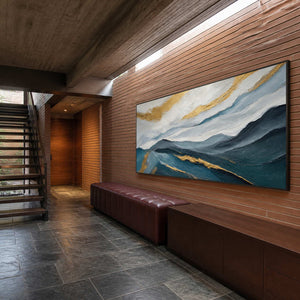 Textured mountain artwork displayed in a dramatic modern entrance hall.