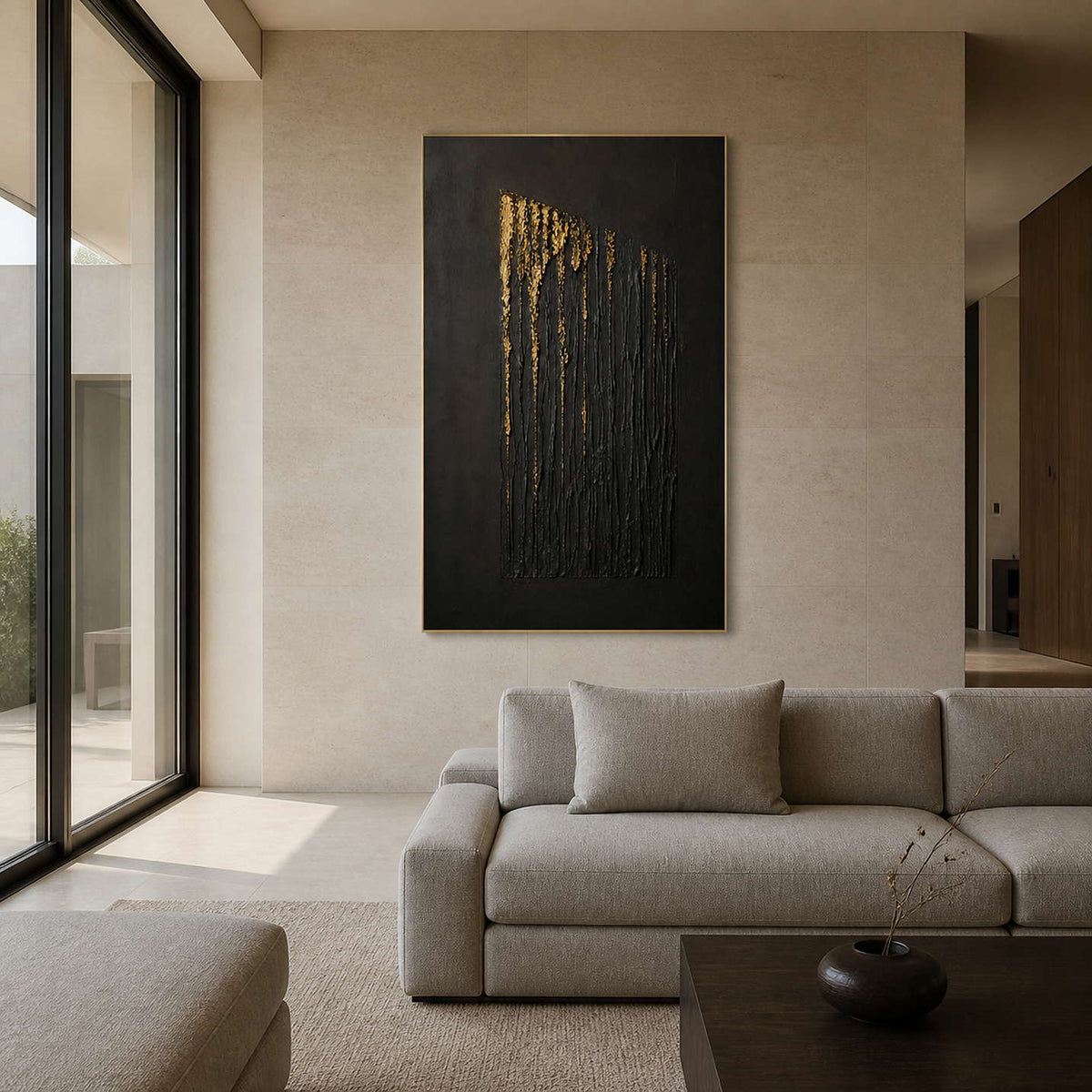 Black and gold textured wall art displayed in a warm ivory living room.