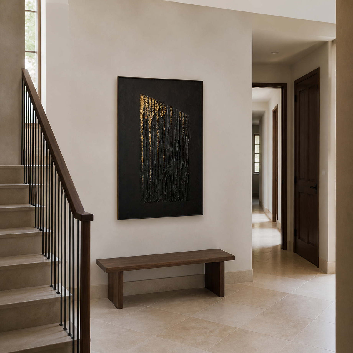 Dramatic black artwork displayed beside a warm stone residential staircase.