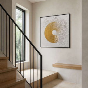 Gold concentric circle wall art beside a contemporary stair landing