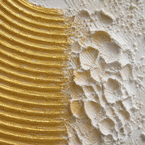 Close detail of sculpted gold ridges and ivory palette knife texture
