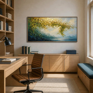 Atmospheric gold and teal landscape canvas in a warm oak office.