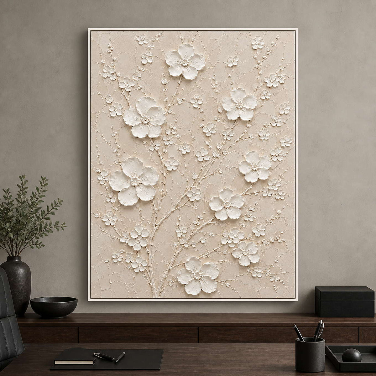 White floral relief painting displayed in an executive office.