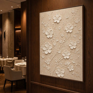 Textured ivory blossom artwork displayed in a warm fine dining room.