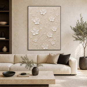 Textured white floral wall art displayed in a serene modern living room.