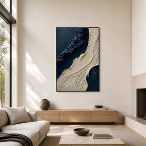 Navy and ivory textured wall art displayed in a double-height modern living room.