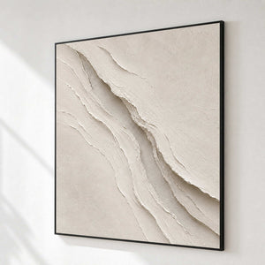 Ivory relief wall art shown from the side on a modern gallery wall.