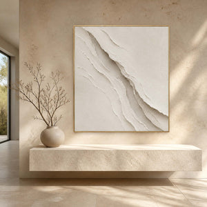 White textured abstract wall art displayed in a natural stone entryway.