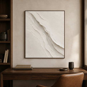 Ivory sculptural wall art displayed in a walnut home office.