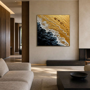 Gold and black coastal wall art displayed in a warm stone walnut living room.