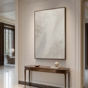 Vertical white textured wall art displayed in an elegant luxury entryway.